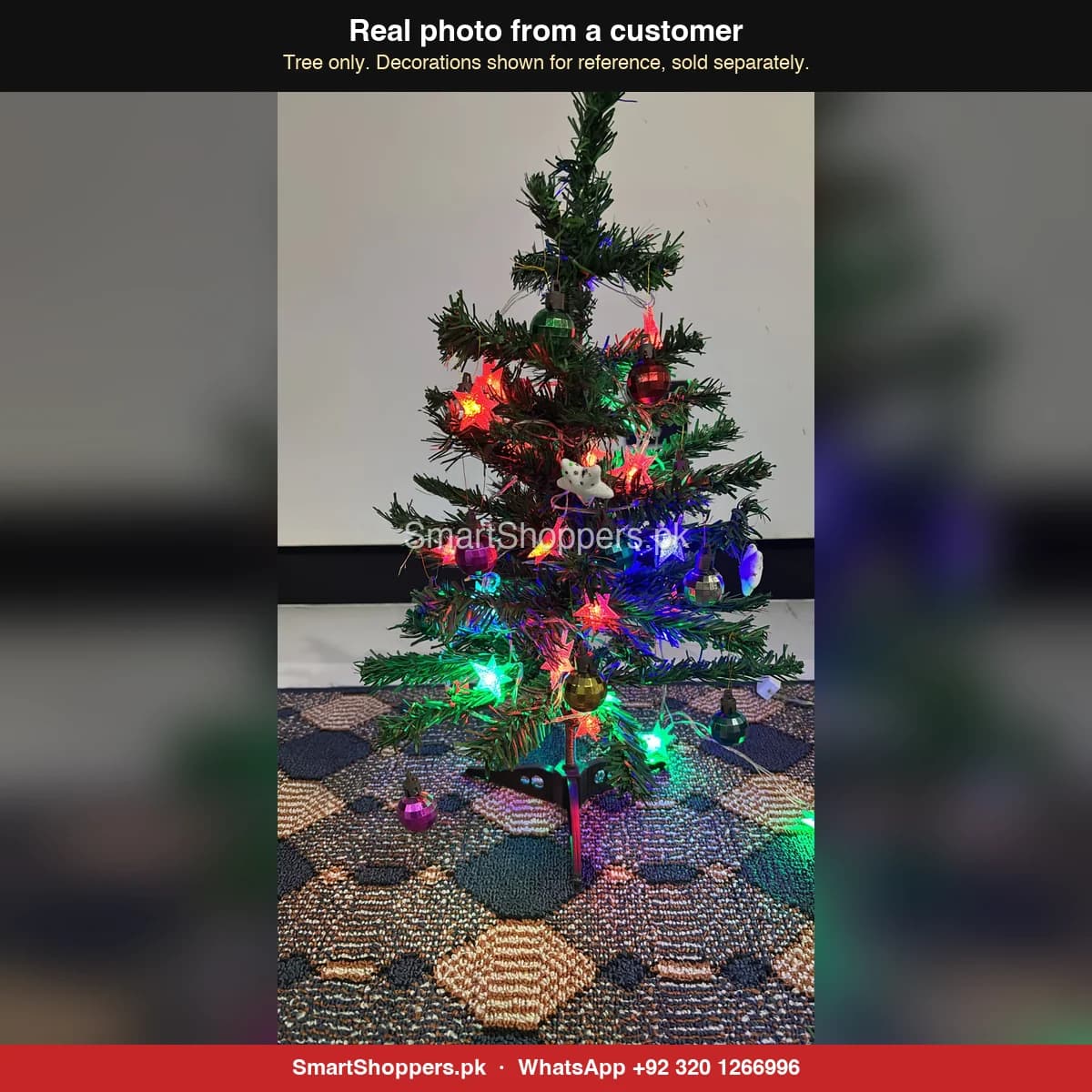 Real customer photo of a 2 ft green artificial Christmas tree bought from SmartShoppers.pk