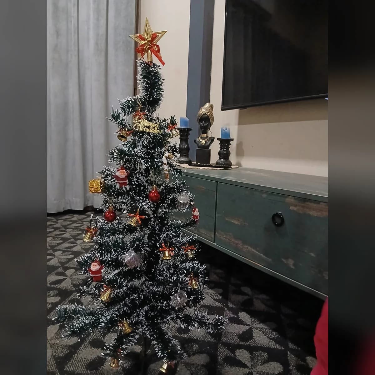 3 ft snow green artificial Christmas tree, set up at a customer's home