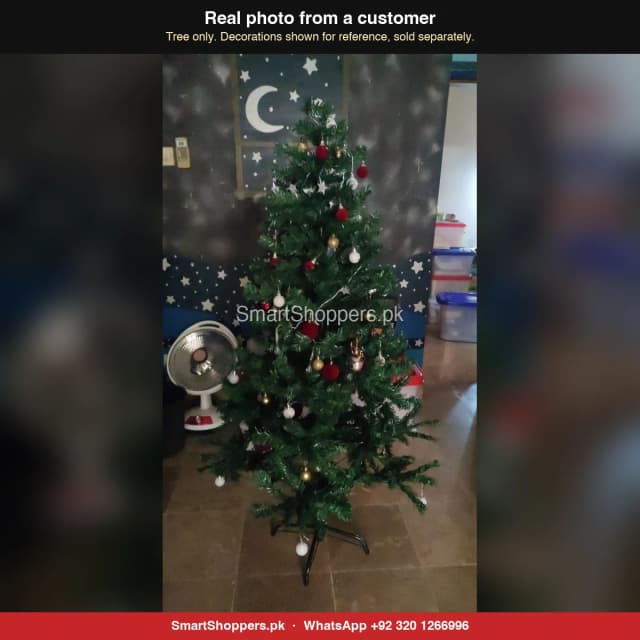 5 ft green Christmas tree with red and white balls in a kids' room