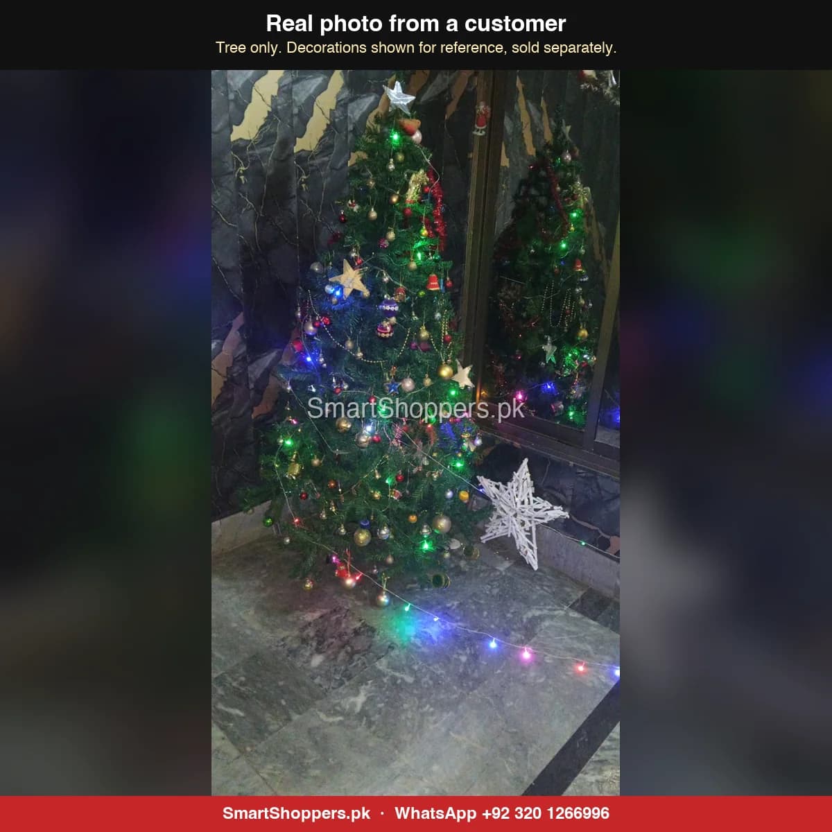 Real customer photo of a 6 ft green artificial Christmas tree bought from SmartShoppers.pk