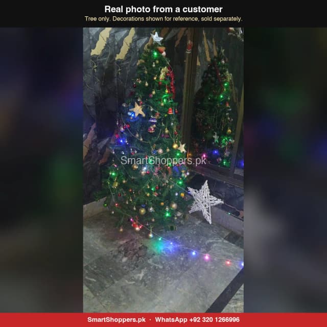 6 ft green Christmas tree with coloured lights and a white star decoration