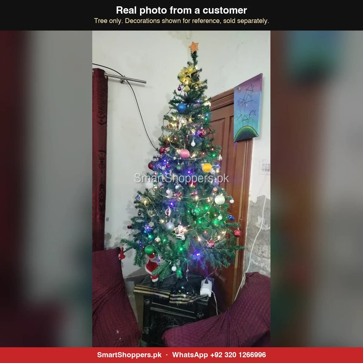 Real customer photo of a 6 ft green artificial Christmas tree bought from SmartShoppers.pk