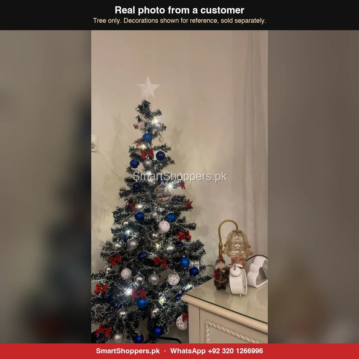 Real customer photo of a 6 ft green artificial Christmas tree bought from SmartShoppers.pk