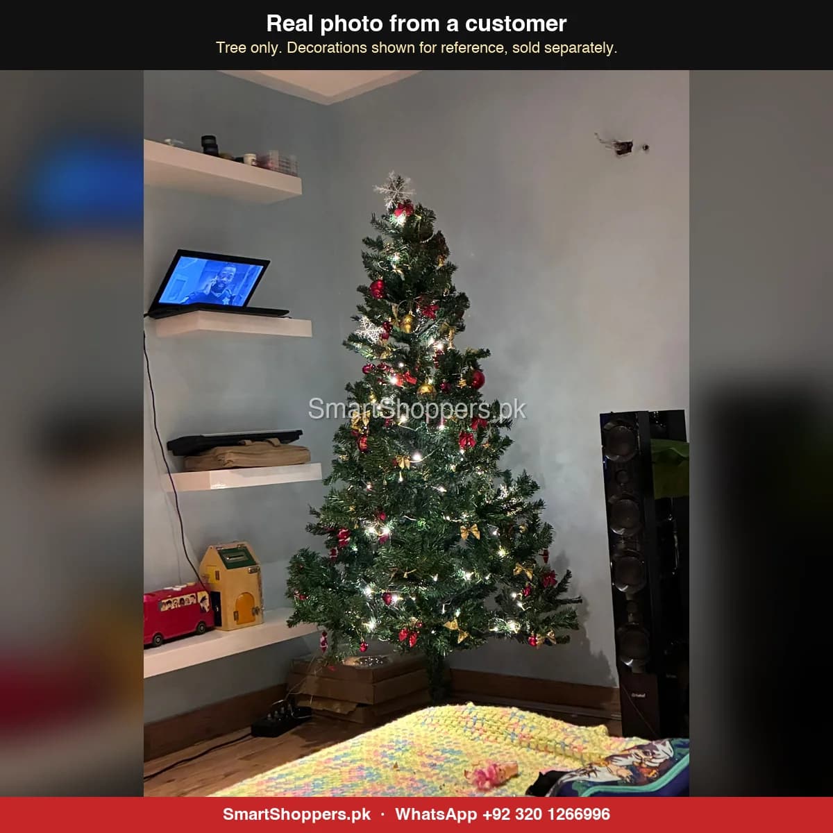 Real customer photo of a 6 ft green artificial Christmas tree bought from SmartShoppers.pk