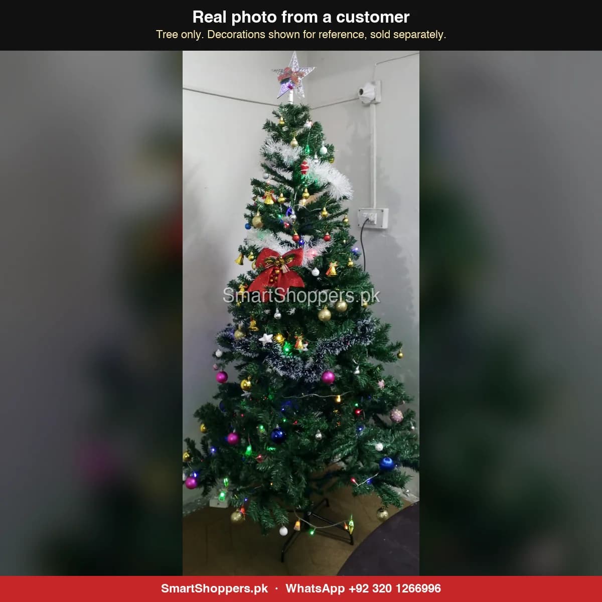 Real customer photo of a 7 ft green artificial Christmas tree bought from SmartShoppers.pk