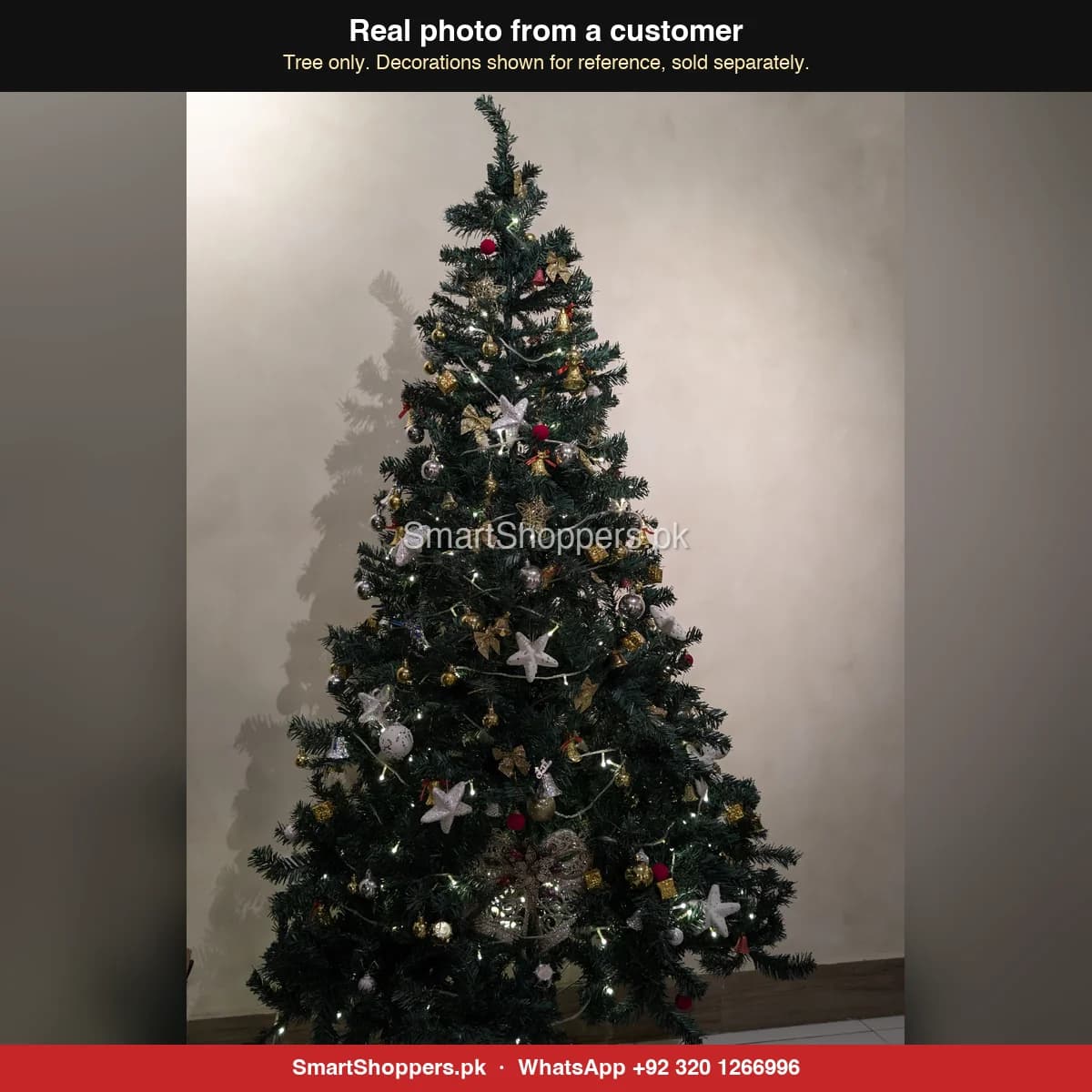 Real customer photo of a 7 ft green artificial Christmas tree bought from SmartShoppers.pk