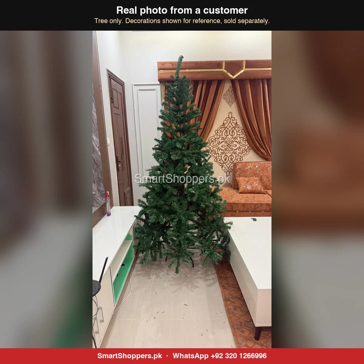 Real customer photo of a 7 ft green artificial Christmas tree bought from SmartShoppers.pk