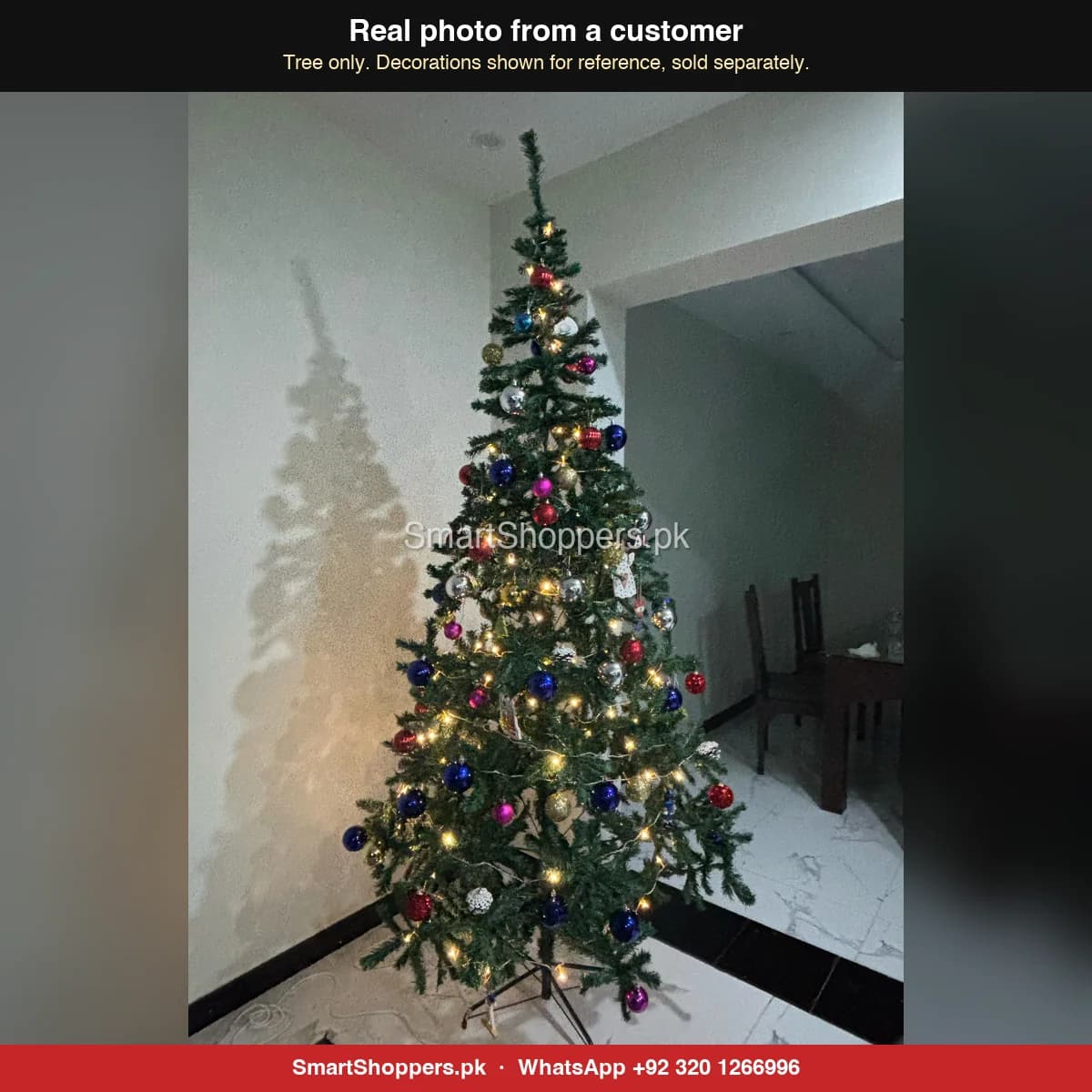 Real customer photo of a 9 ft green artificial Christmas tree bought from SmartShoppers.pk