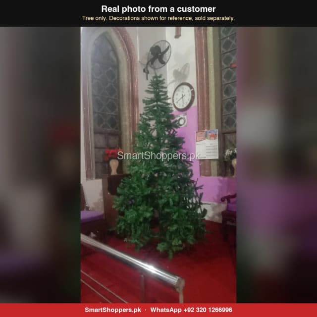 9 ft green Christmas tree set up in a church, before decorating