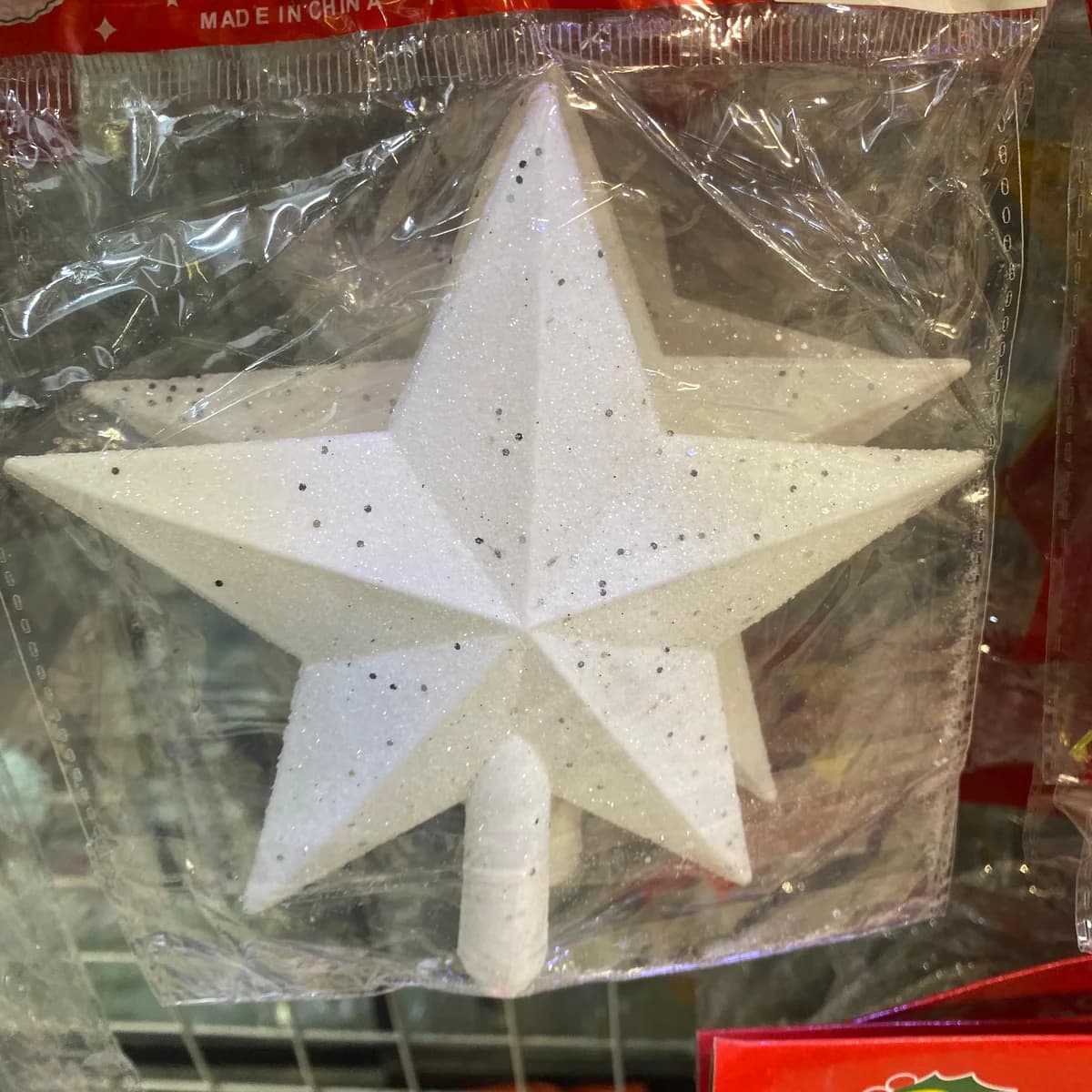 White glitter star tree topper for Christmas tree, real photo