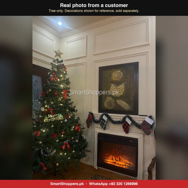 8 ft green Christmas tree with a gold star and a Merry Christmas sign beside a fireplace