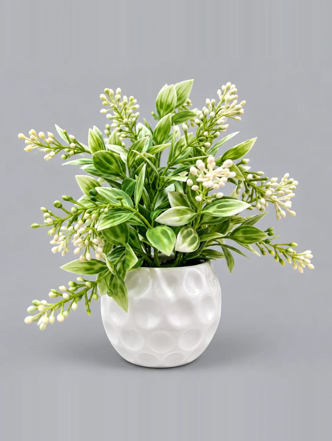 Artificial Green and White Leaf Plant with Cream Buds in White Dimpled Round Pot