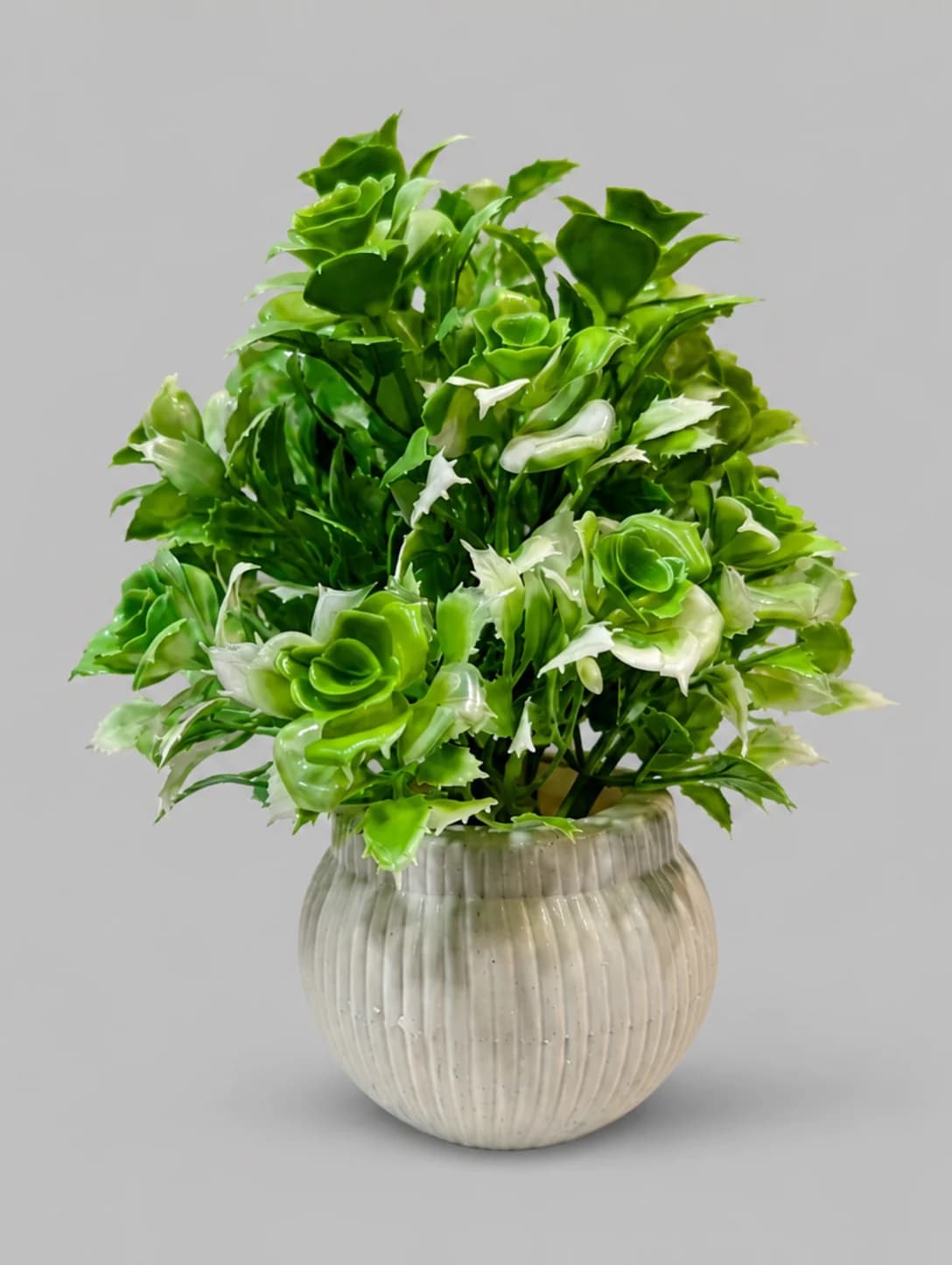Artificial Green and White Leafy Plant in Grey Ribbed Round Pot