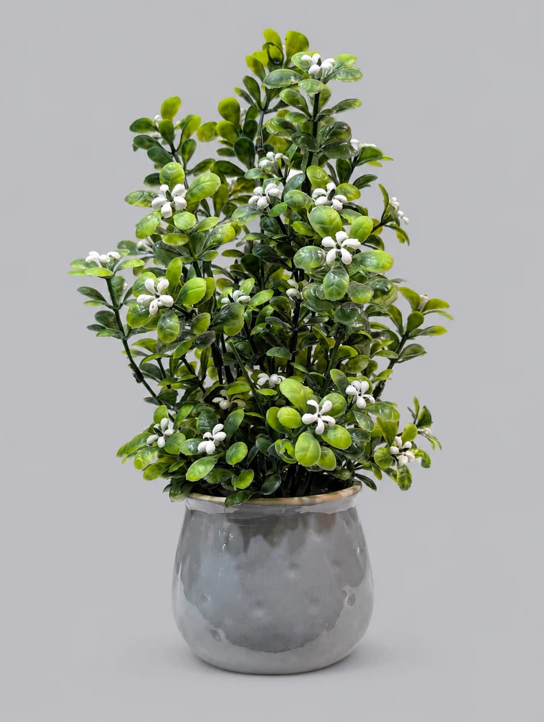 Artificial Green Leaf Plant with Small White Flowers in Grey Glossy Pot