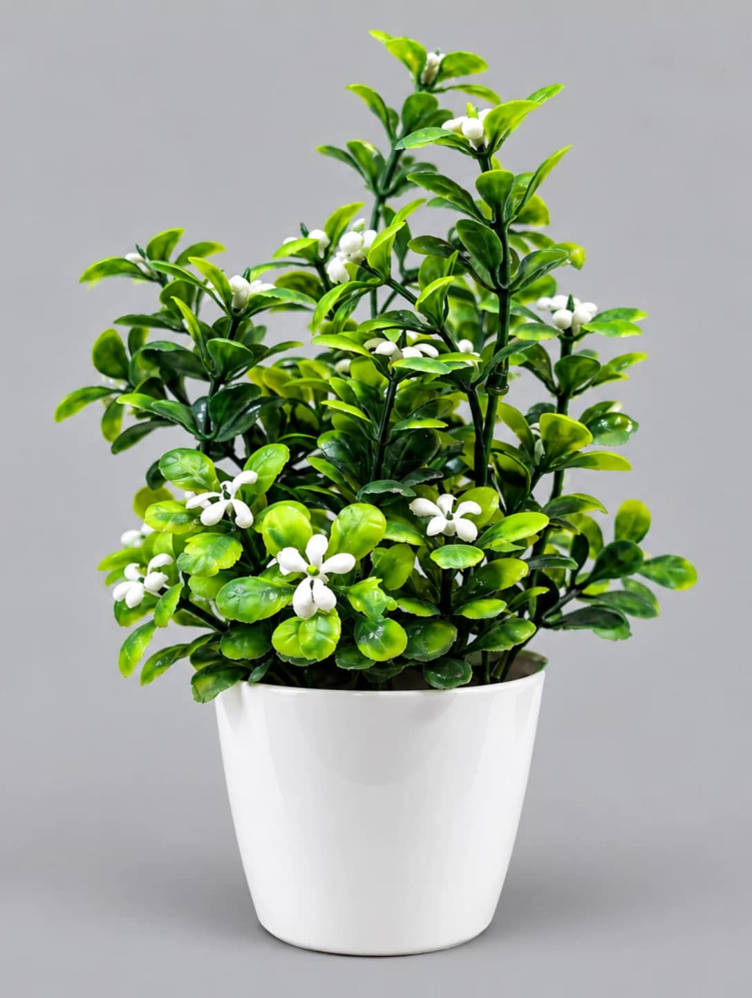 Artificial Green Leaf Plant with Small White Flowers in White Glossy Pot