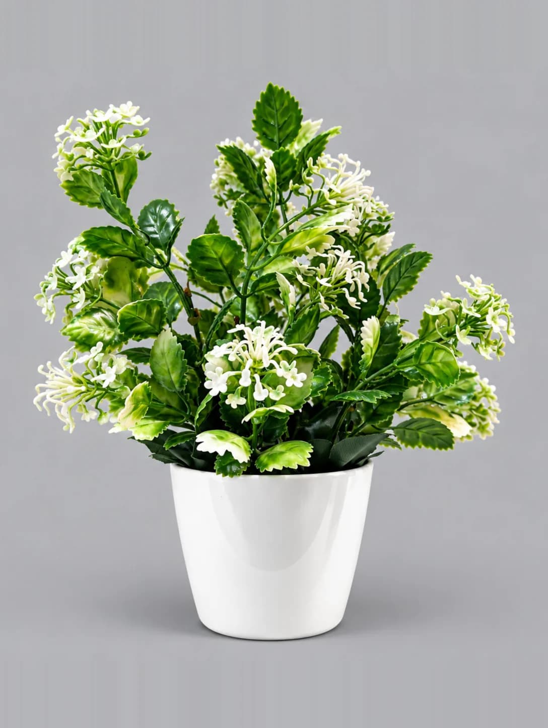 Artificial Green Leaf Plant with White Flower Sprays in White Glossy Pot