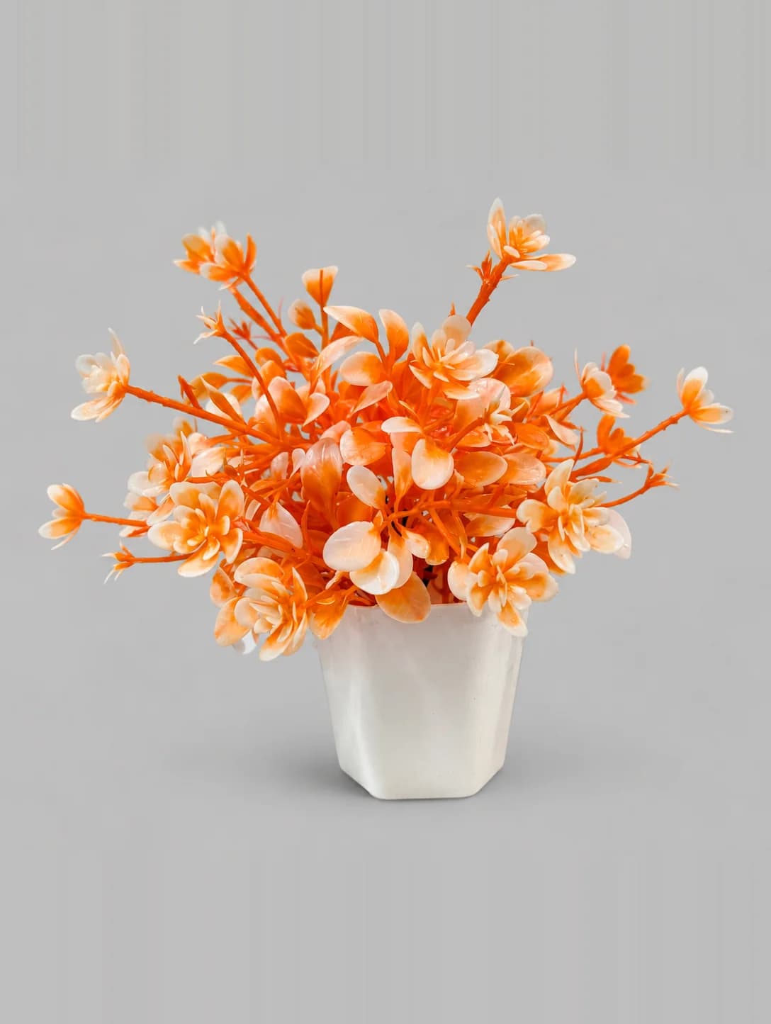 Artificial Orange and White Flower Plant in White Hexagonal Pot