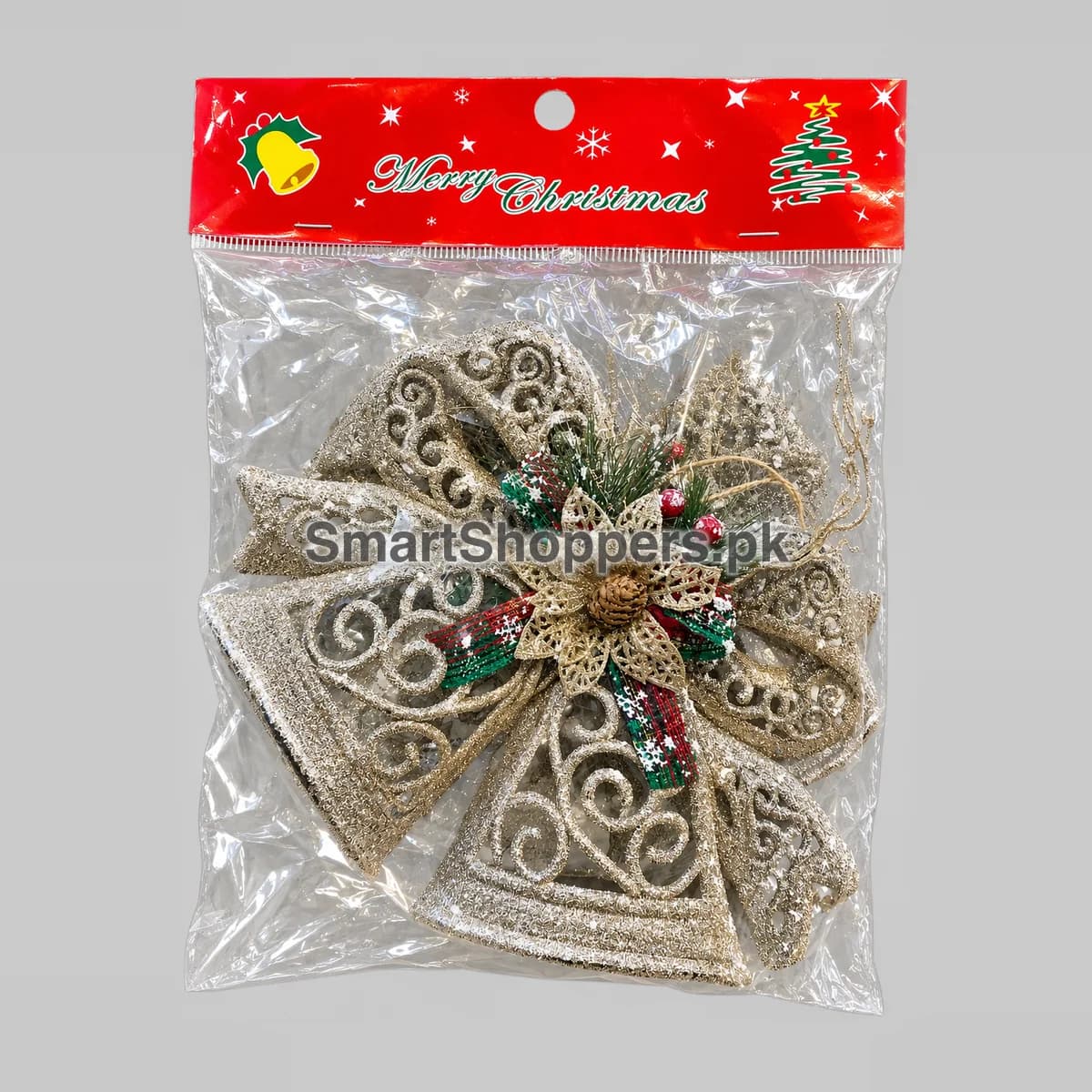 Large gold glitter bell ornament with gold poinsettia, pine sprigs, red berries and tartan ribbon, in its pack