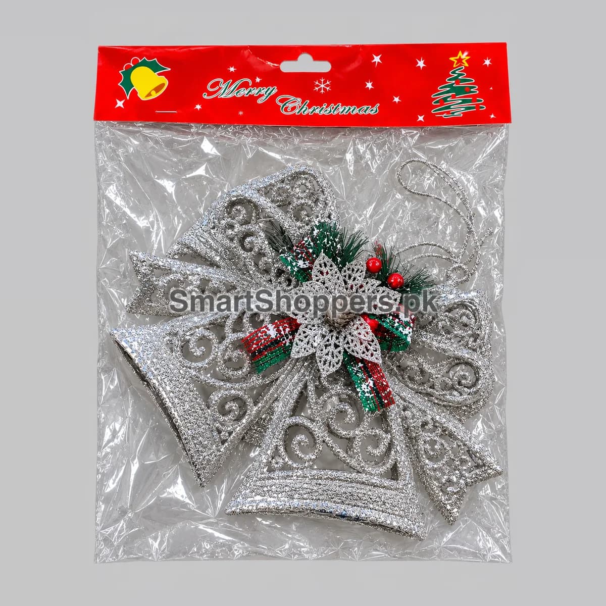 Large silver glitter bell ornament with holly, red berries and a glitter flower, in its pack