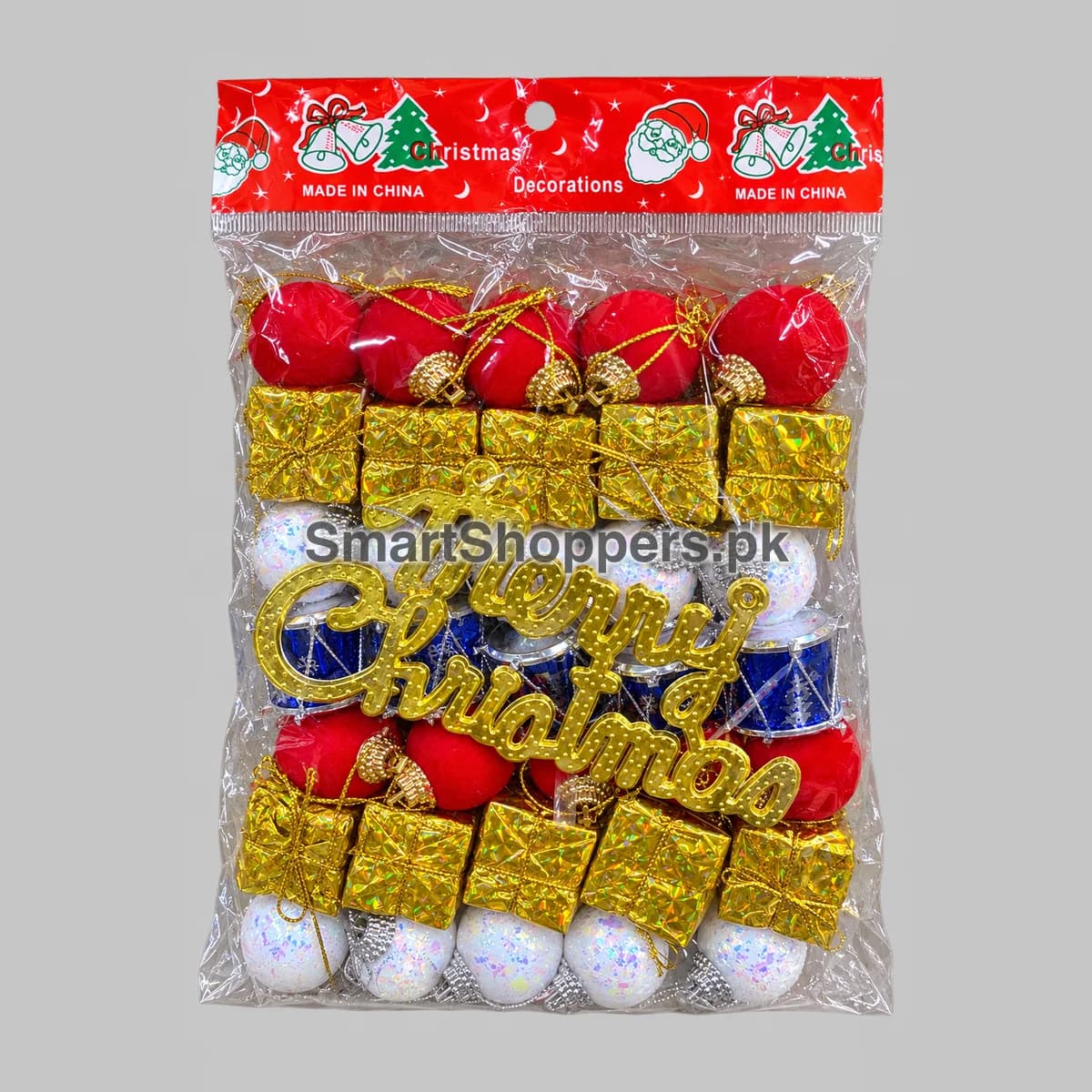 Merry Christmas mixed ornament pack with a gold sign, red and white balls, gold gift boxes and blue drums