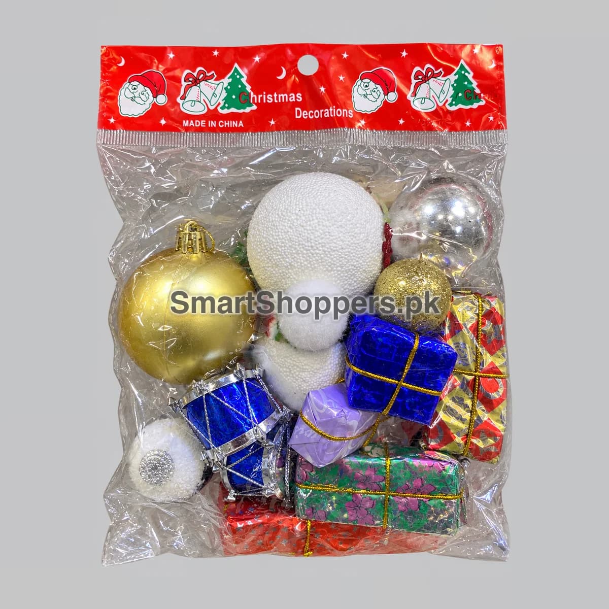Mixed Christmas ornament pack in a clear hanging bag: gold, white, silver and blue balls, blue drums and foil gift boxes