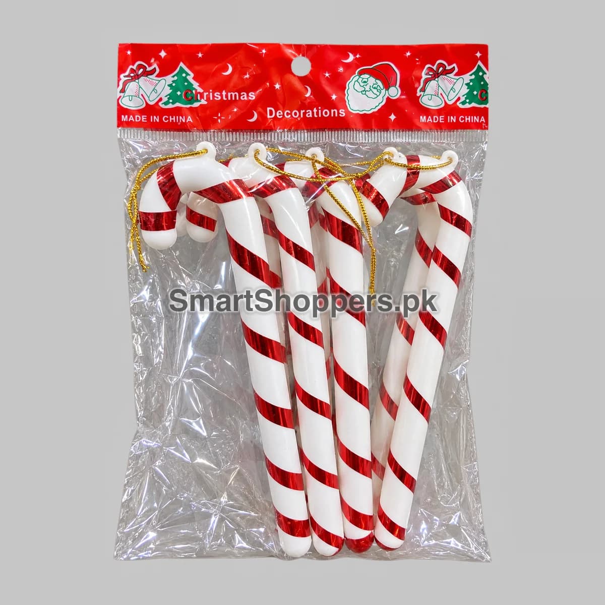 Large red and white striped candy canes for Christmas tree decoration, in their pack
