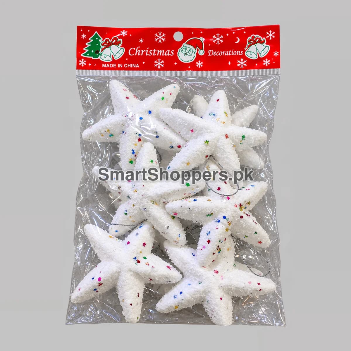 Pack of 6 white glitter star ornaments with coloured sequins, in their bag