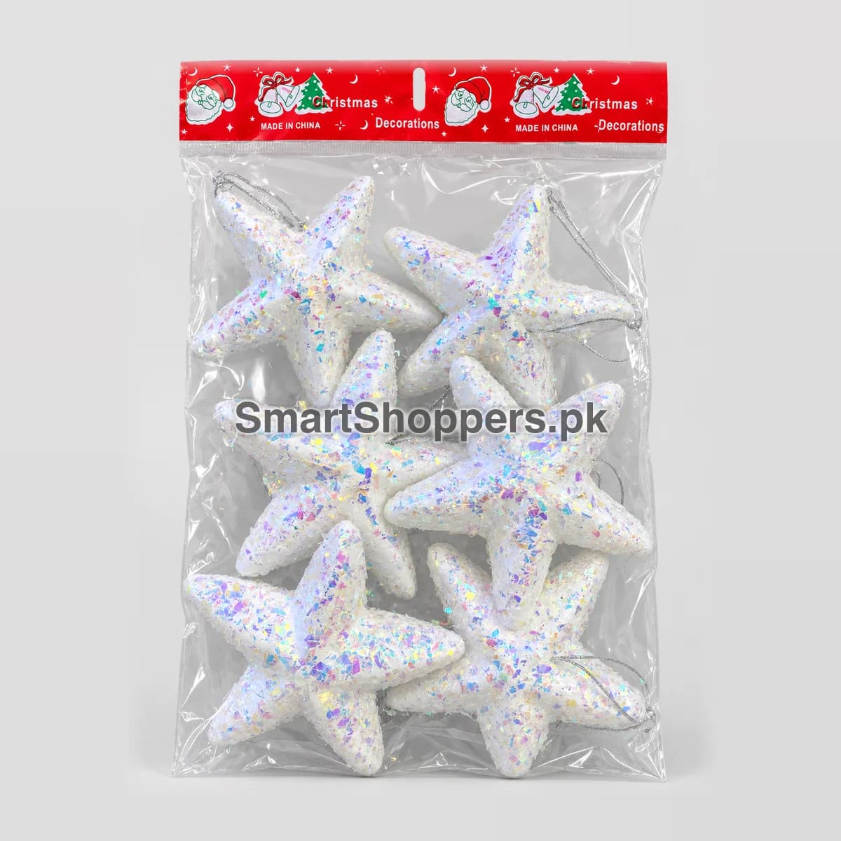 Pack of 6 white iridescent glitter stars with silver hanging cords, in their bag