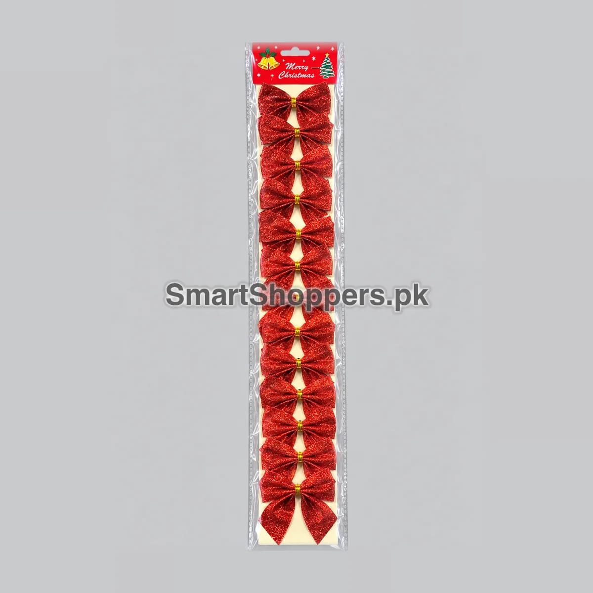 Strip of 12 small red glitter bows with gold clasps on a card with a Merry Christmas header, in its bag