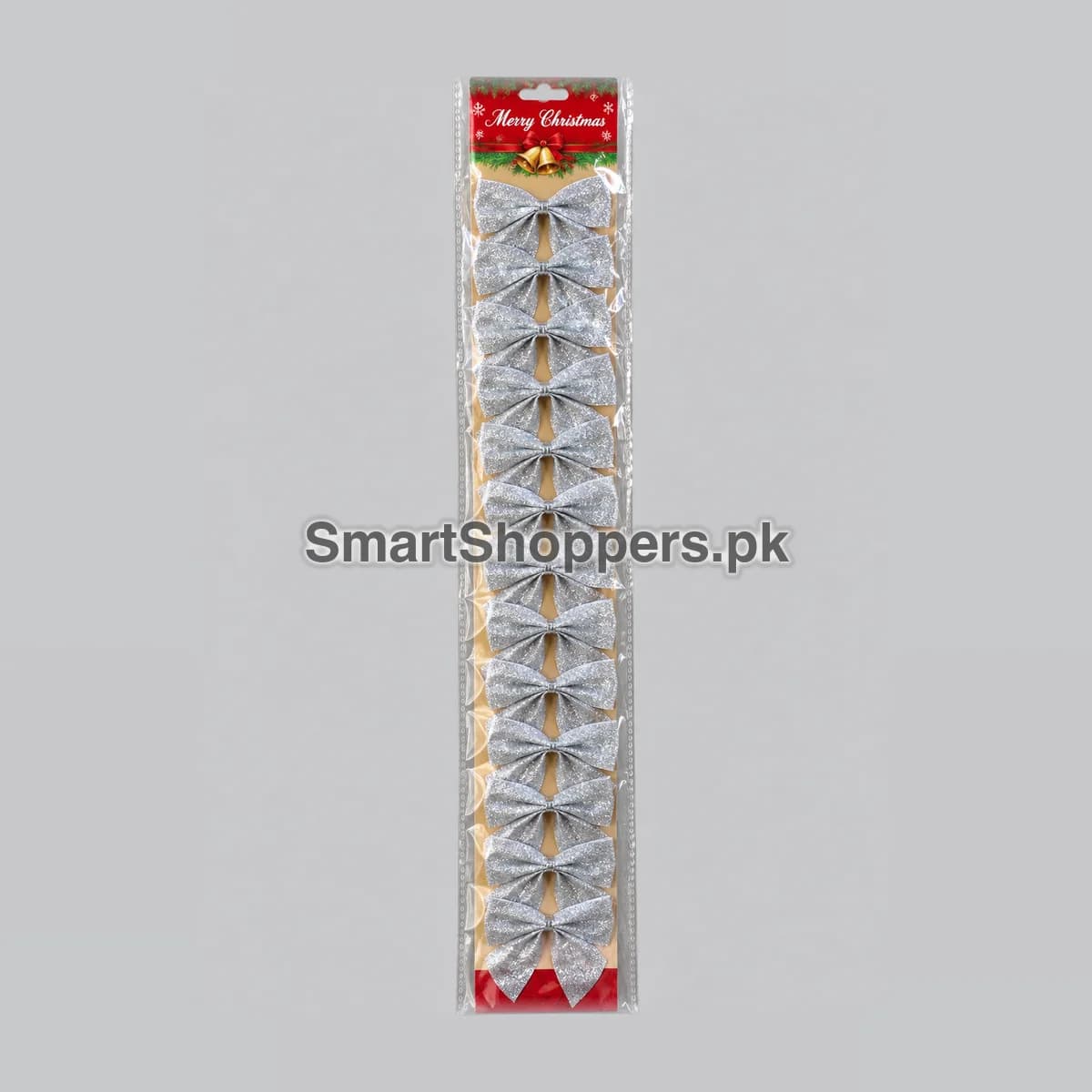 Strip of 12 small silver glitter bows on a card with a Merry Christmas header, in its bag